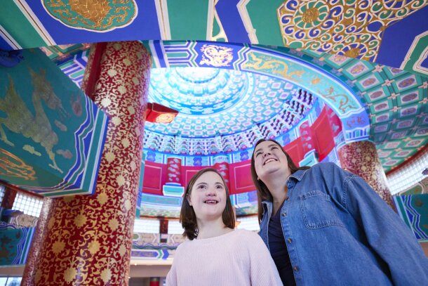 mother and daughter admire the ornate ceiling of the Calgary Chinese Cultural Centre