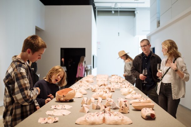 Kids and adults enjoying an exhibit at the Esker Foundation
