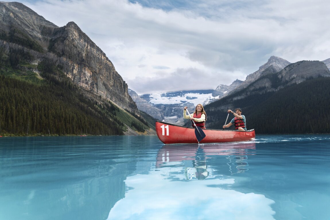 Couple canoeing on Lake Louise in Banff National Park
