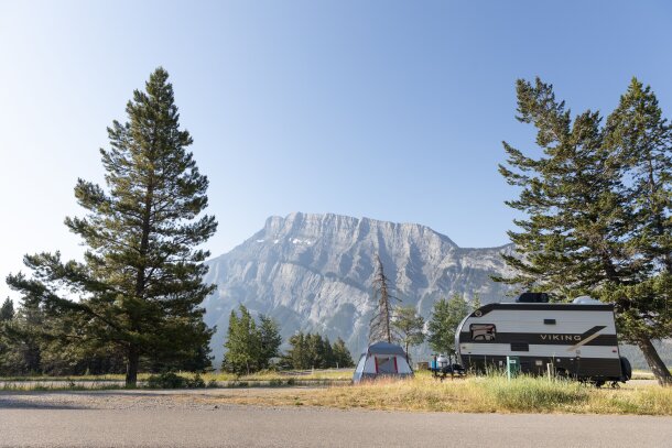 Campsite with Rundle mountain behind at Tunnel Mountain Trailer Court in Banff National Park