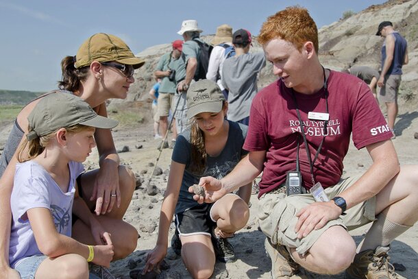 Kids learning about dinosaur fossils while on a dig at Royal Tyrrell Museum in Drumheller