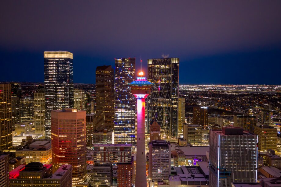 Drone shot of Calgary Tower with the torch lit