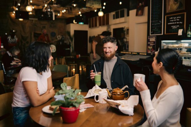 Trio enjoying coffee at Congress Coffee