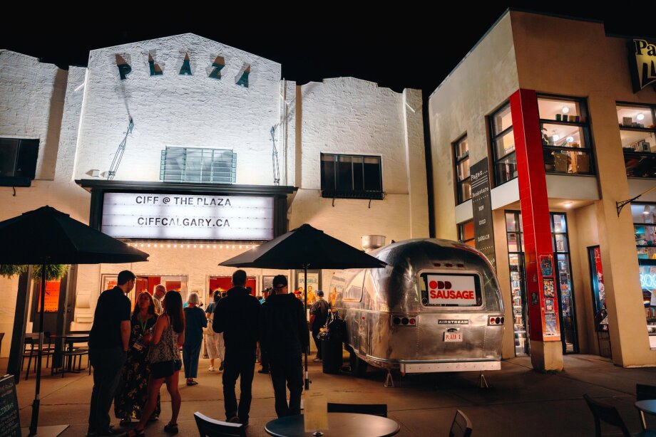 A group of people wait outside The Plaza Theatre during CIFF.