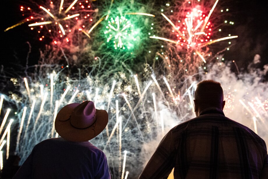 2 people watching a display of fireworks