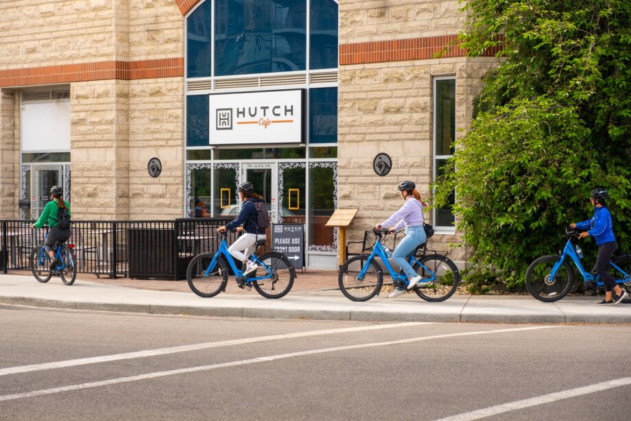 Food Bike Tour group cycling past Hutch Café in Calgary