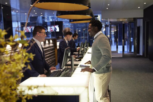 a man checking in to Hotel Le Germain in downtown Calgary