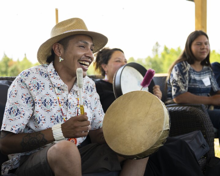 Indigenous man drumming