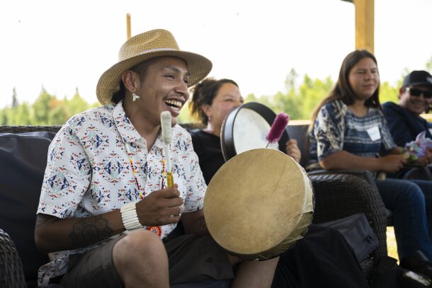 Indigenous man drumming