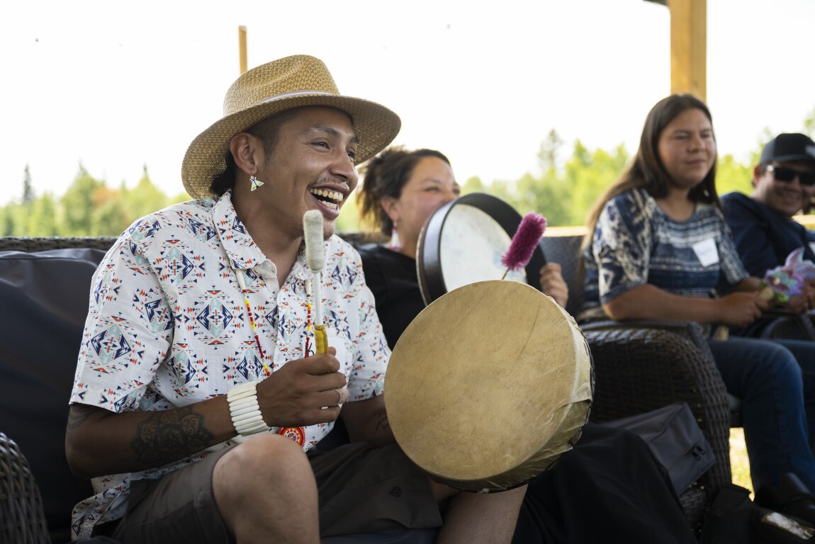 Indigenous man drumming