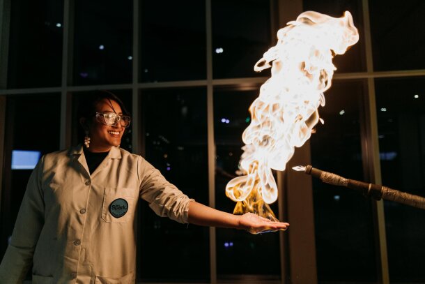 TELUS Spark Science Centre worker demonstrating fire