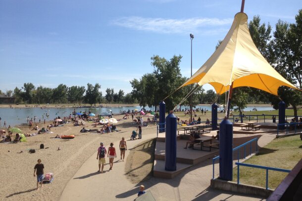 The beach on a busy day at Sikome Lake in Fish Creek Park in Calgary