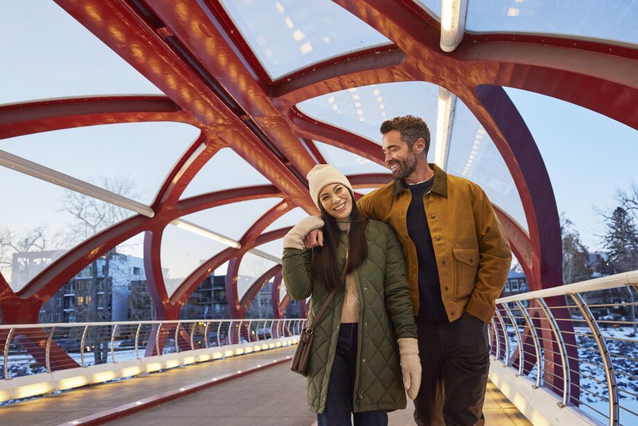Couple walking on Peace Bridge Calgary