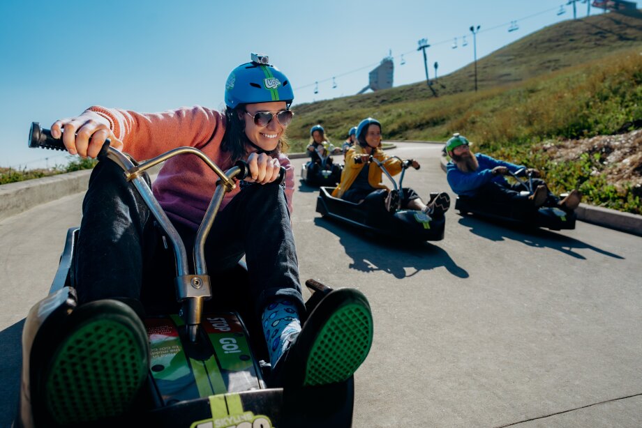 a group of friends enjoying downhill karting at winsport