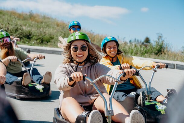 group of friends enjoying Downhill karting during summer