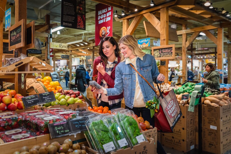 two ladies picking out produce at Calgary Farmers Market South