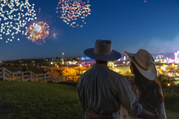 Couple watching fireworks at the Calgary Stampede